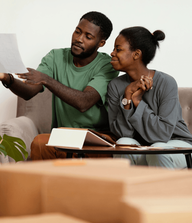 man and woman staring at a sheet of paper